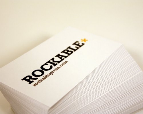 Stack of white business cards on white background